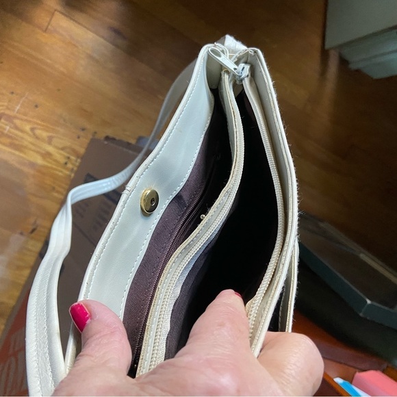 Leather shoulder handbag has 5 compartments that zip or snap for easy access. - Picture 8 of 8